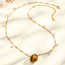 Gold tiger eye pendant necklace with round stone charm and adjustable chain for boutique wholesale jewelry
