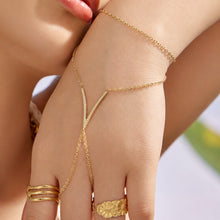 Model wearing gold zircon hand chain bracelet with V-shaped charm, 316L stainless steel finger bracelet for boutique jewelry styling