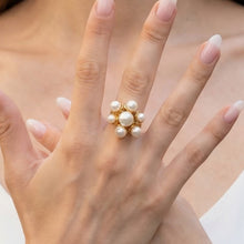 Minimalist gold open pearl ring worn on a model hand