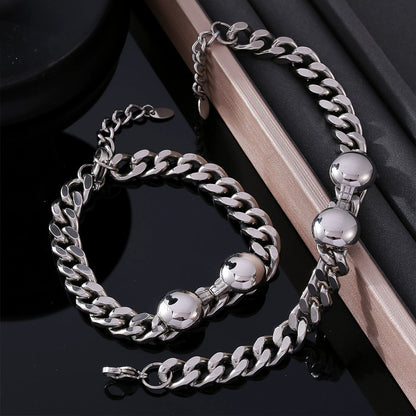 Minimalist stainless steel chain bracelet and necklace display for boutique unisex jewelry assortments