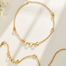 Mixed oval link chain necklaces with asymmetric geometric links in gold tone