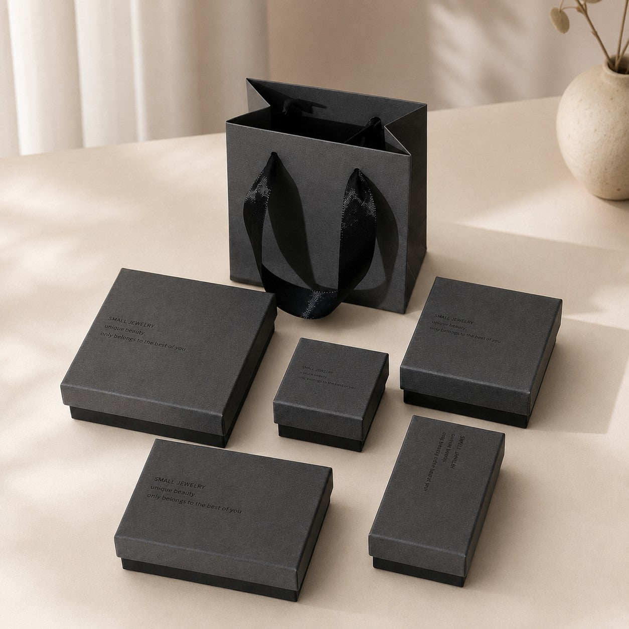 Modern charcoal gray jewelry packaging boxes with matching gift bag for boutiques