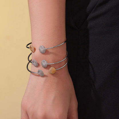 model wearing multi-color shell diamond cuff bracelets, stacked style, casual fashion accessory