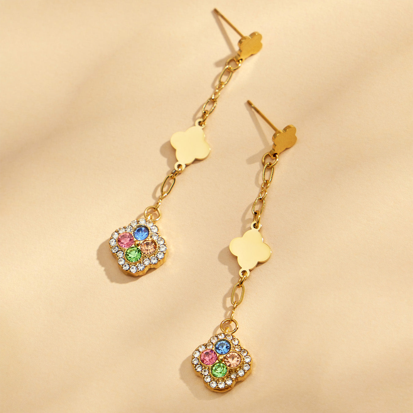 Gold four leaf clover drop earrings with multicolor crystal pavé details