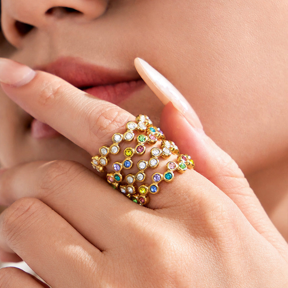 Model wearing a multicolor cubic zirconia statement ring with a wide multi-row design