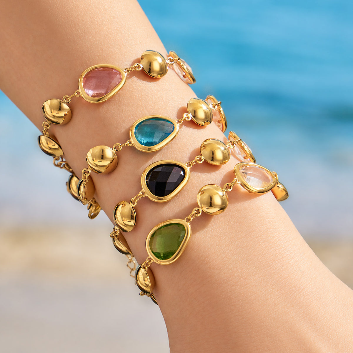 Colorful glass stone bracelets styled on wrist