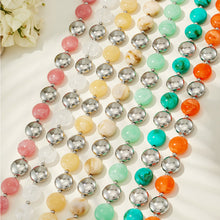Flat lay assortment of colorful resin bracelet and necklace styles in multiple fashion color combinations.