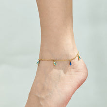 Gold-tone multicolor teardrop zircon anklet worn around the ankle