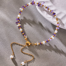 Natural stone beaded necklace with a gold-tone clasp and adjustable extender chain