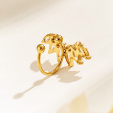 Back view of a gold stainless steel leaf ear cuff showing the curved metal bands, open ends and rounded ball tips