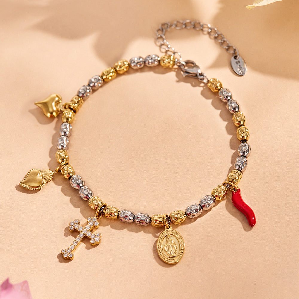 Detail of the charm bracelet showing the gold finish