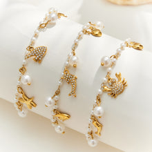 Gold marine charm pearl bracelet assortment with pearl beads and ocean-themed stainless steel charms