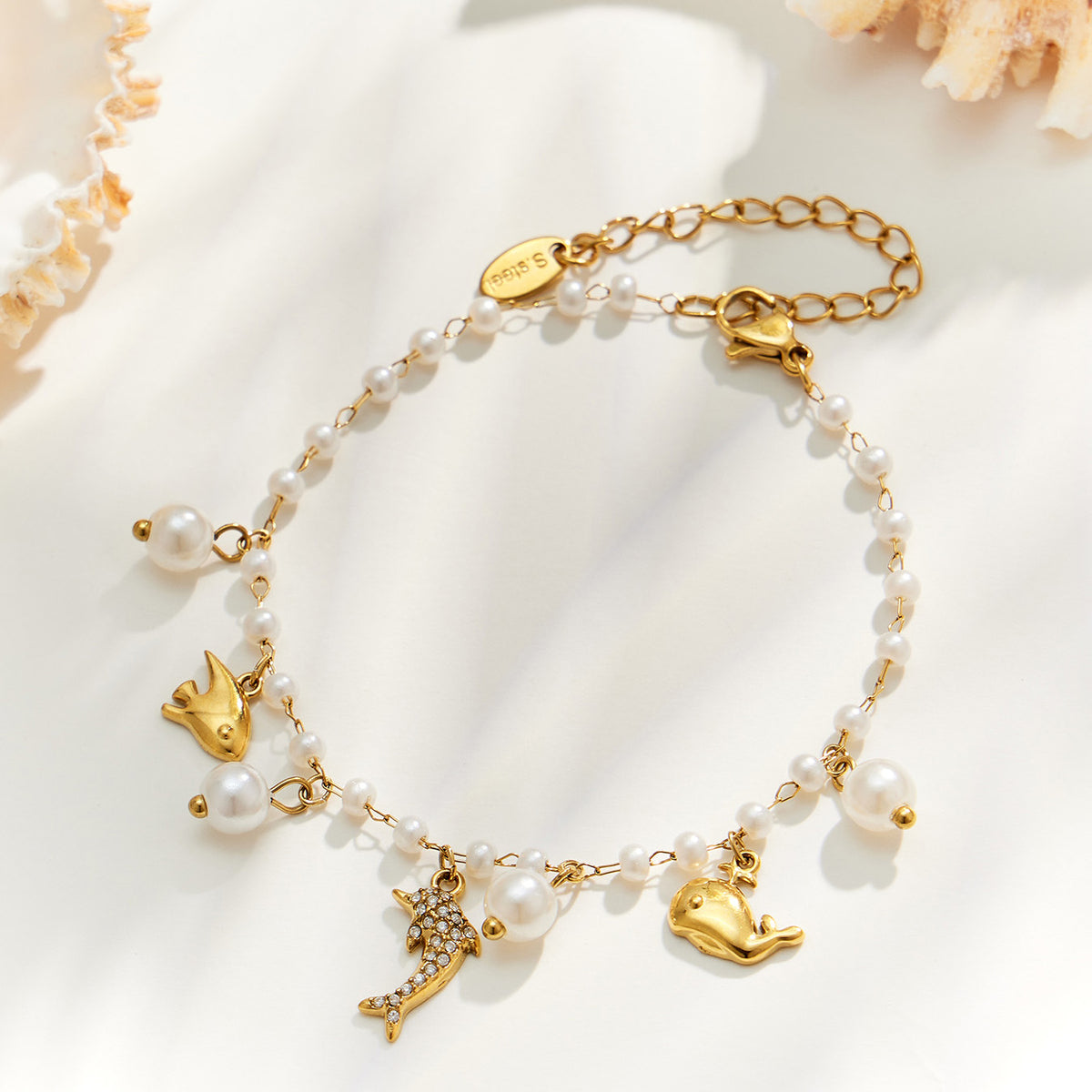 Gold dolphin ocean charm pearl bracelet with marine charms and pearl beads in stainless steel