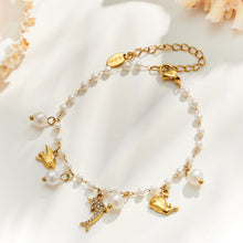 Gold dolphin ocean charm pearl bracelet with marine charms and pearl beads in stainless steel