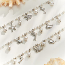 Steel finish ocean charm pearl bracelet collection with three marine-inspired charm designs