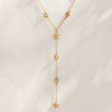 P181 gold-tone starfish zircon Y necklace displayed with fine chain and long drop