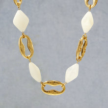 P673 ivory square resin necklace shown hanging with geometric resin pieces and chunky 18K PVD gold chain links