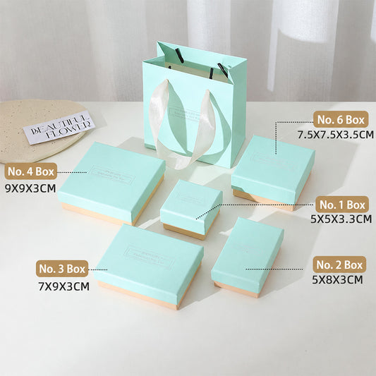 Pastel blue and pink jewelry packaging boxes in multiple sizes for rings earrings bracelets necklaces and jewelry sets