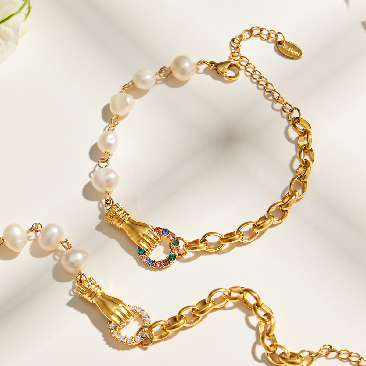 Freshwater pearl and stainless steel chain bracelet with colorful zircon centerpiece detail