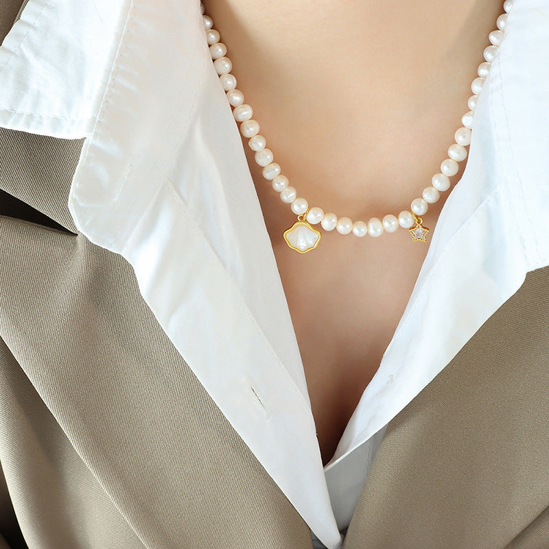 Elegant pearl pendant necklace on display