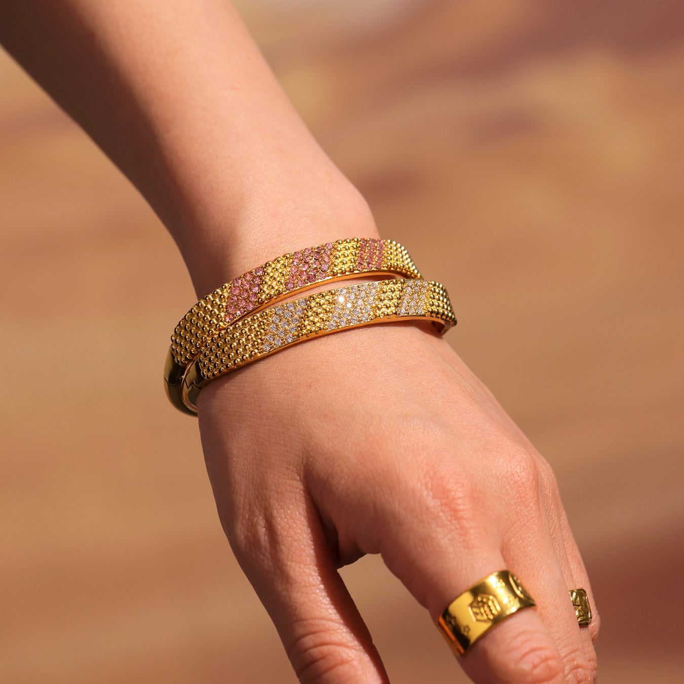 18k gold plated pink 5a zircon bangle, model wearing on wrist