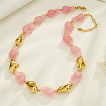 Pink resin necklace and matching bracelet set with chunky organic beads and gold accents