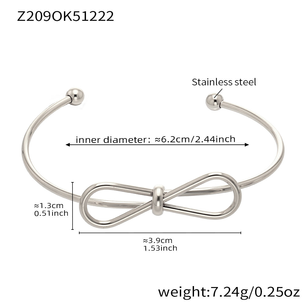 Polished silver stainless steel bow bangle spec view, inner diameter 6.2cm, weight 7.24g