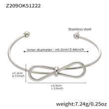 Polished silver stainless steel bow bangle spec view, inner diameter 6.2cm, weight 7.24g