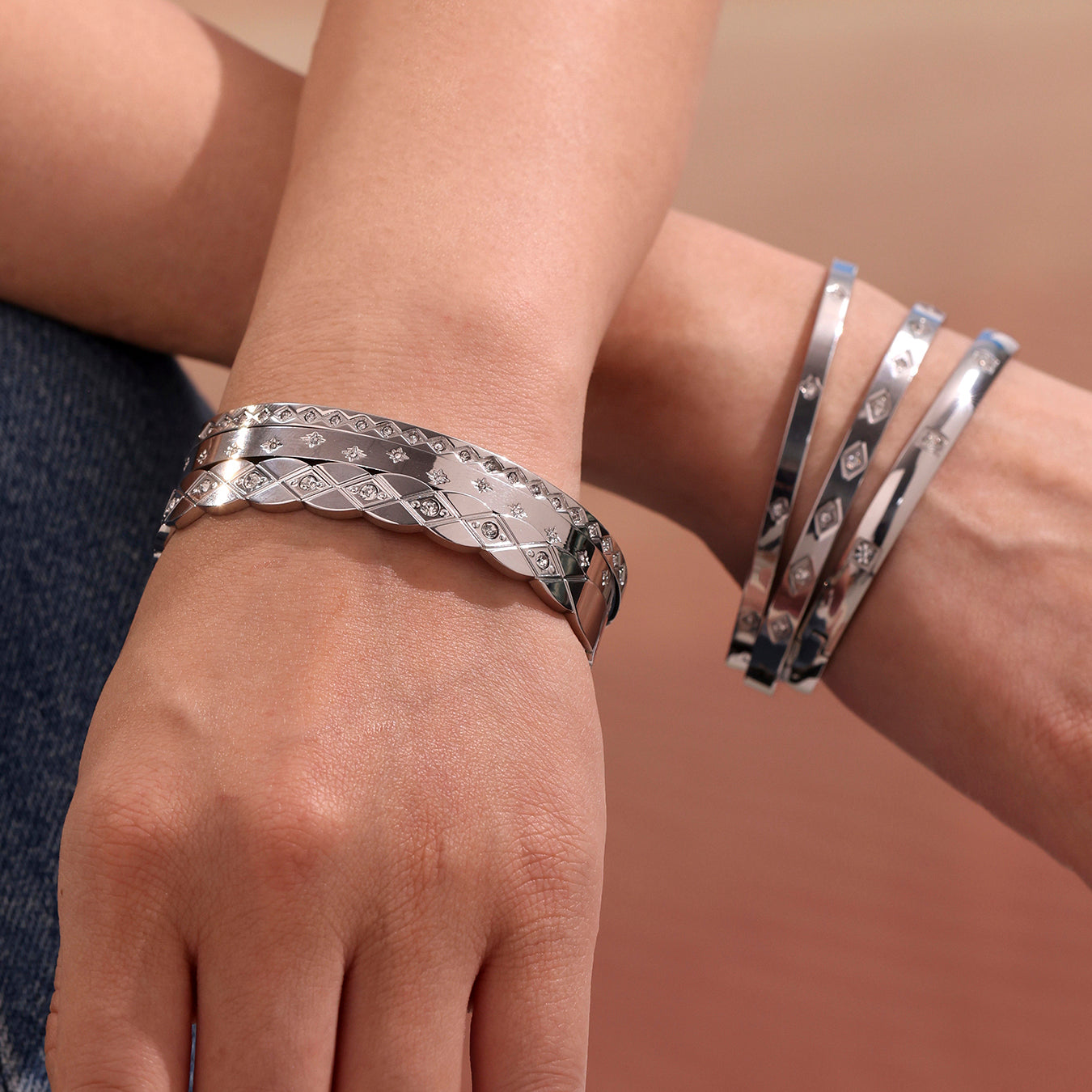 model wearing polished silver titanium steel zircon bangle set, casual european fashion look