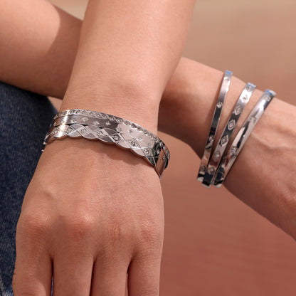 model wearing polished silver titanium steel zircon bangle set, casual european fashion look