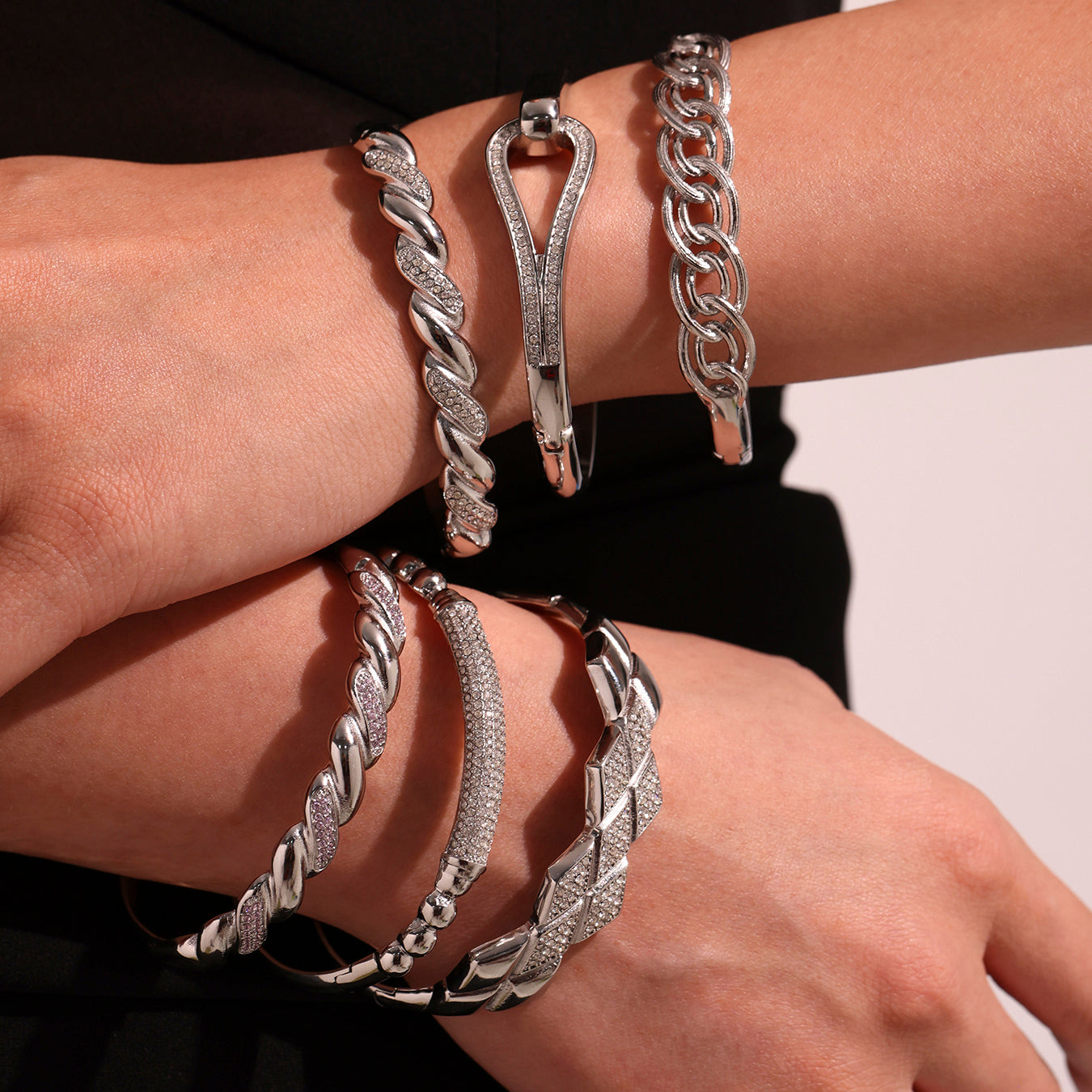 Model stacking polished silver stainless steel zircon bangles, European minimalist fashion
