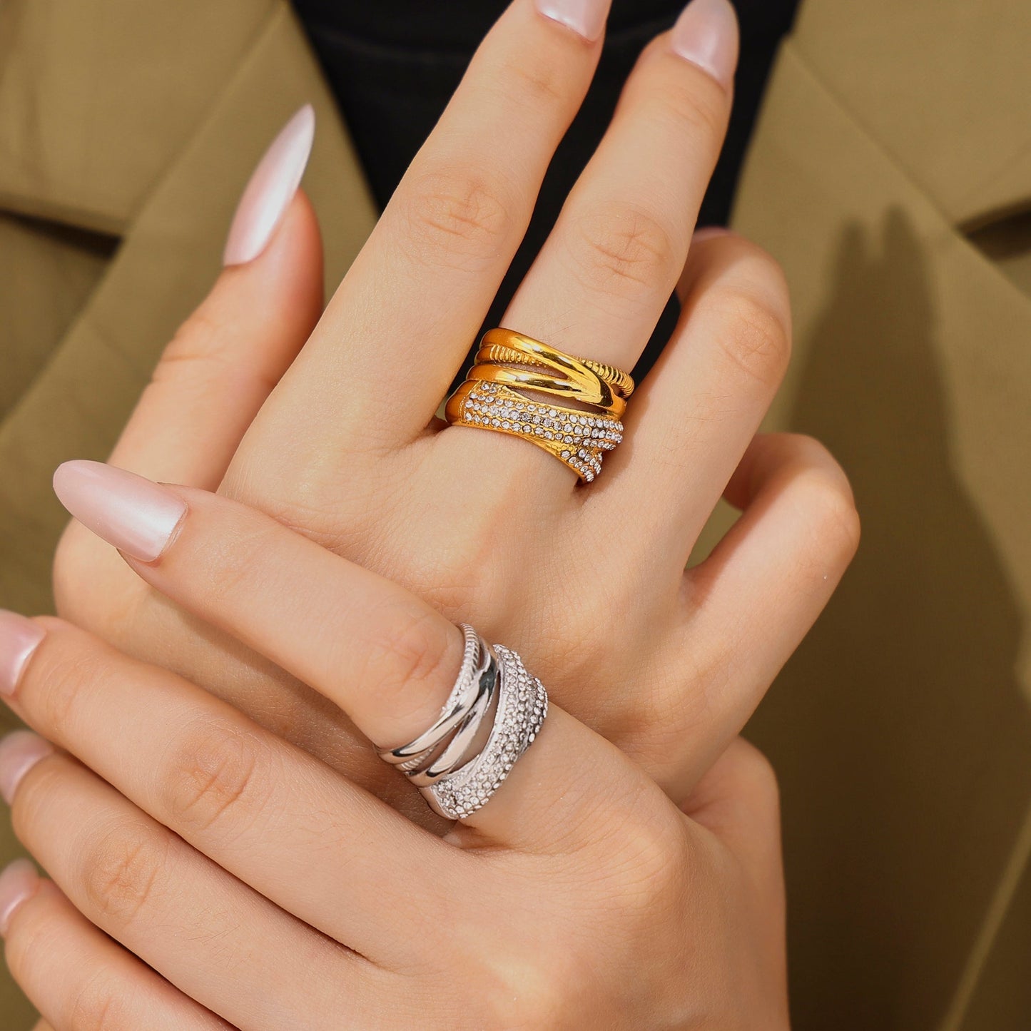 Model wearing a polished steel wide band cubic zirconia statement ring