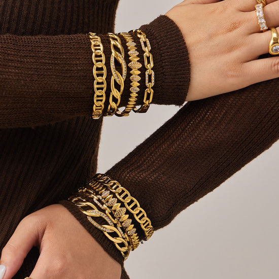 Real product showcase of premium 316L stainless steel chain bangles with 18K gold PVD plating and 5A zircon details. Hypoallergenic, waterproof, and tarnish-resistant for daily wear, ideal for wholesale.