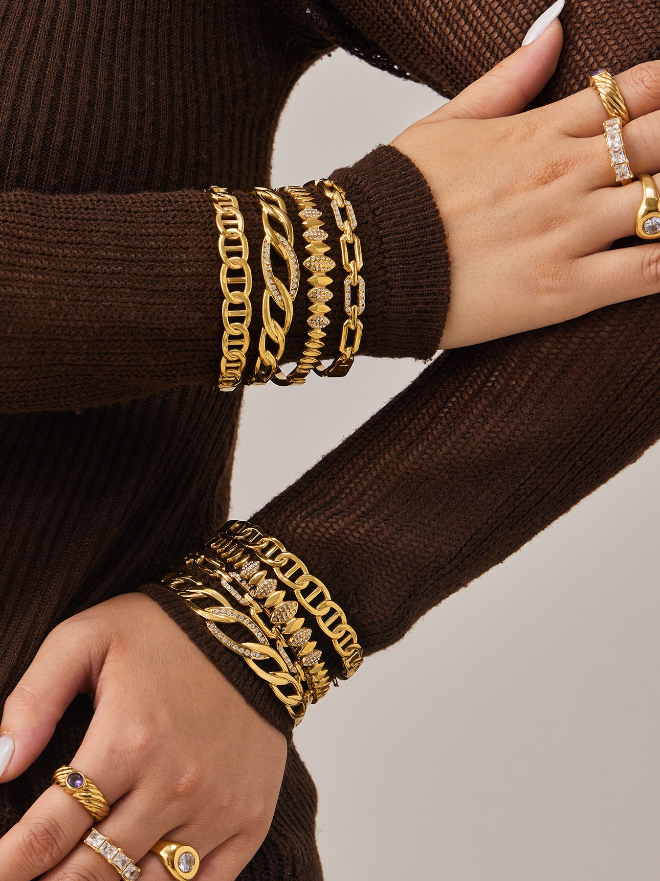 Real product showcase of premium 316L stainless steel chain bangles with 18K gold PVD plating and 5A zircon details. Hypoallergenic, waterproof, and tarnish-resistant for daily wear, ideal for wholesale.