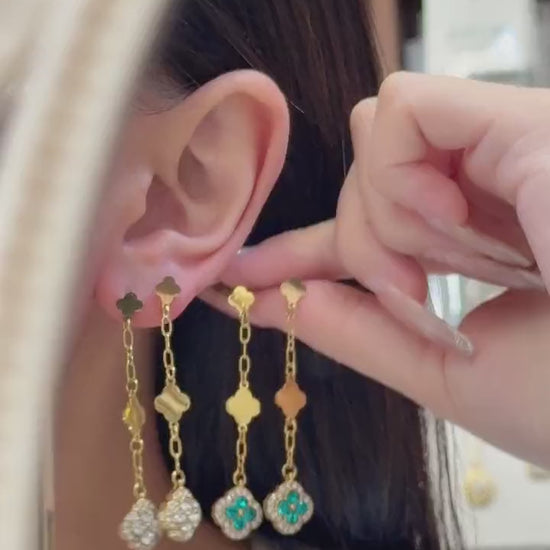 Video of model wearing colorful four leaf clover crystal drop earrings in 18K PVD gold and steel tone 316L stainless steel
