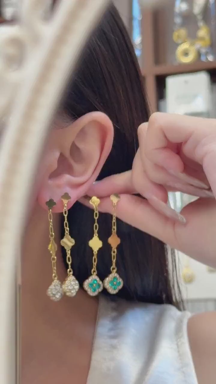 Video of model wearing colorful four leaf clover crystal drop earrings in 18K PVD gold and steel tone 316L stainless steel