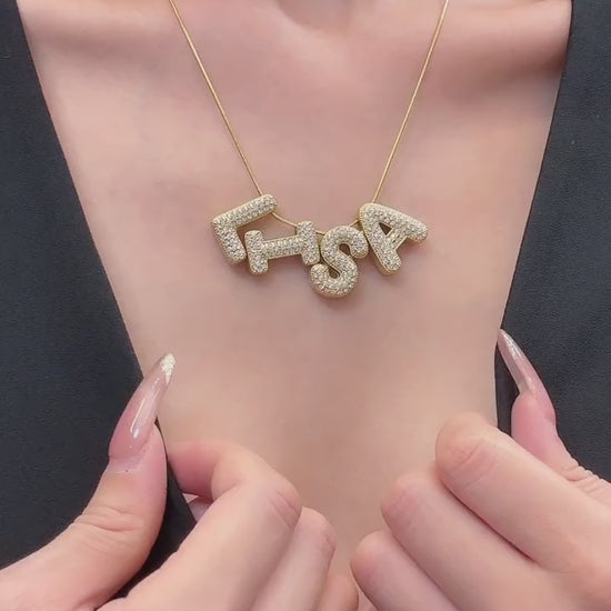 Video showing 316L stainless steel DIY letter charm necklace base in 18K PVD gold and polished steel for personalized boutique jewelry