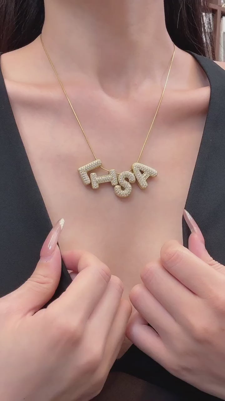 Video showing 316L stainless steel DIY letter charm necklace base in 18K PVD gold and polished steel for personalized boutique jewelry