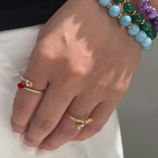Colorful round-bead bracelets with gold-tone spacers and sparkling accent beads shown stacked on the wrist.