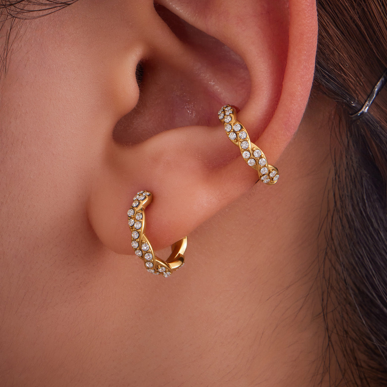 Three-Layer Zircon Ear Cuff in 316L Stainless Steel. This clip-on ear cuff features a multi-band design with sparkling cubic zirconia, perfect for non-pierced ears. Hypoallergenic, waterproof, and tarnish-resistant for everyday wear.