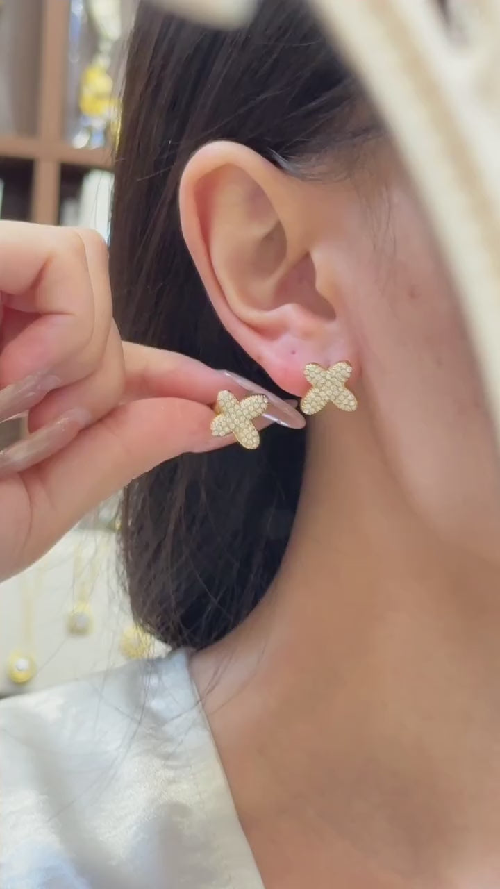 Video showing 316L stainless steel A-Z initial letter stud earrings in 18K PVD gold for personalized boutique jewelry