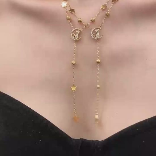 Video cover showing model wearing gold cat moon zircon Y lariat necklace with star charms in 316L stainless steel by Miduoduo Jewelry