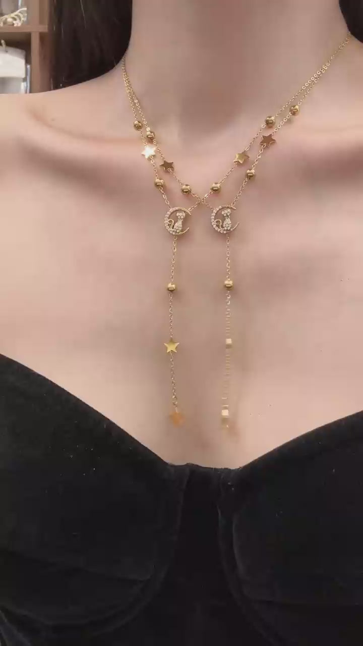Video cover showing model wearing gold cat moon zircon Y lariat necklace with star charms in 316L stainless steel by Miduoduo Jewelry