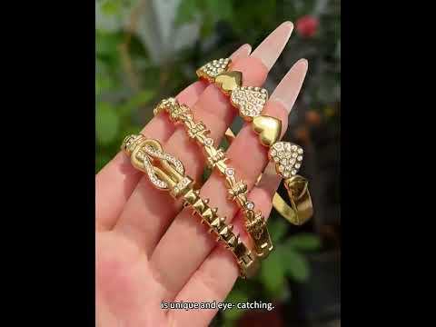 Crafted designer inspired heart lock bangle in 316L stainless steel with 18K PVD gold plating. Quiet luxury style, waterproof, tarnish free and hypoallergenic. Easy lock clasp for daily wear, EU certified, low MOQ wholesale supply for boutique business.