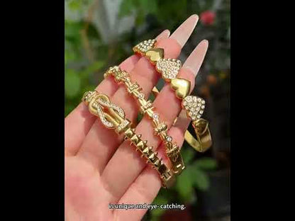 Crafted designer inspired heart lock bangle in 316L stainless steel with 18K PVD gold plating. Quiet luxury style, waterproof, tarnish free and hypoallergenic. Easy lock clasp for daily wear, EU certified, low MOQ wholesale supply for boutique business.
