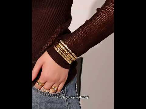 Real product showcase video showcasing the premium texture of 316L stainless steel bangle with 18K gold PVD plating and sparkling 5A zircon details. Features sleek geometric design, tarnish-resistant and easy to wear.