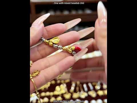 Video showing 18K PVD gold CZ lucky charm bracelet made with 316L stainless steel for wholesale jewelry buyers