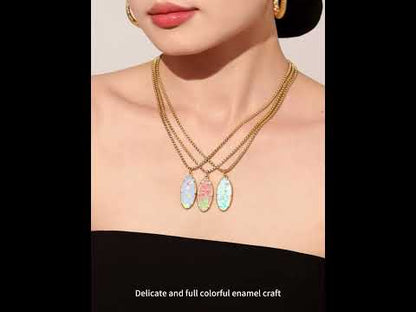 Model wearing 18K PVD gold droplet flower pendant necklace made from 316L stainless steel, showing colorful pendant details for wholesale jewelry buyers