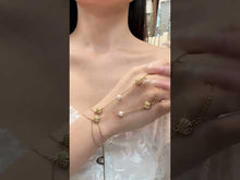 Gold shell zircon hand chain bracelet for women with pearl detail in stainless steel