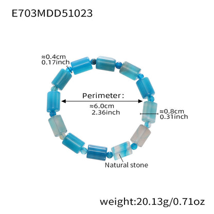 Model wearing multiple 316L Stainless Steel natural stone stretch bracelets, layered waterproof style